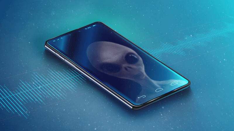 Un teléfono virtual con la imagen de un extraterrestre reflejada en la pantalla y una onda sonora estilizada de fondo.